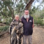Image of Deb in possum skin cloak standing with wawa biik guide
