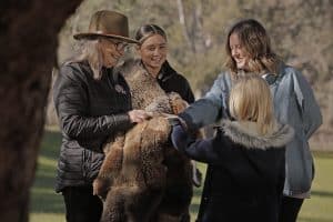 Anne and Bonnie and guest with possum cloak
